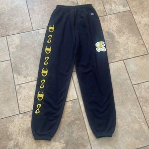 Champion black NFINITY sweat pants with gold glitter logo